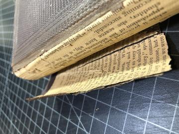 A book with the spine open up. 