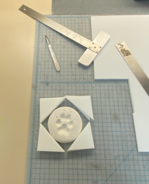 A plaster paw print in a custom enclosure. 