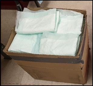 A box full of folded rain catchers.