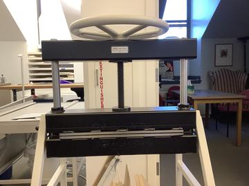 A multi-use tool for bookbinding and conservation.