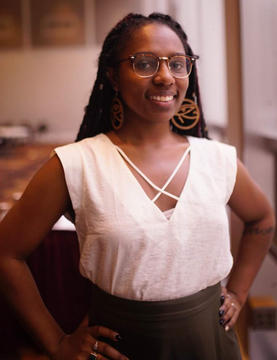 A young woman posing for the photo.