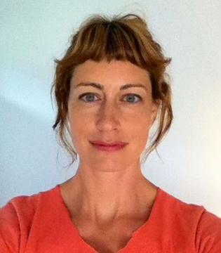 A woman with bangs and a red shirt.