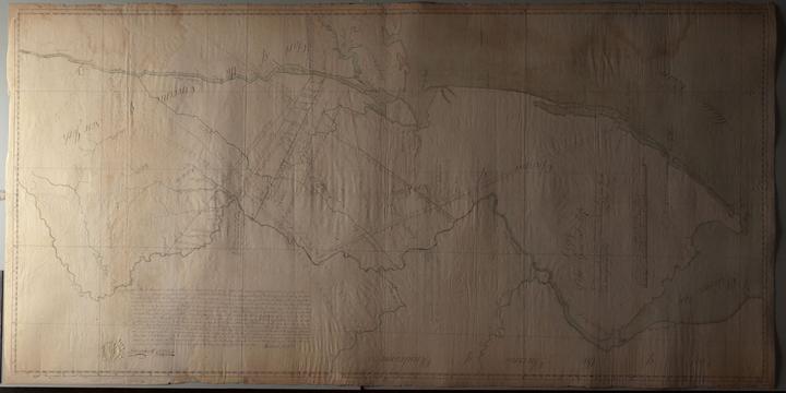 A photo of a large map taking with raking light.