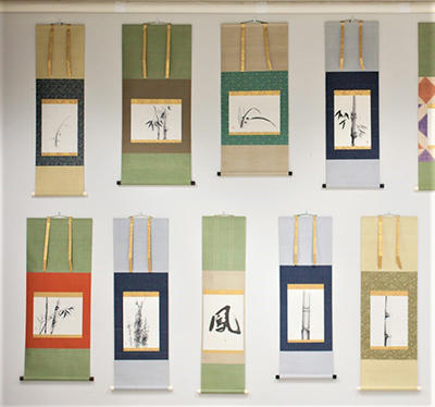 9 Japanese Scrolls hanging on a wall