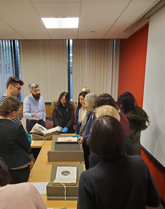 Students in HU Archives looking at more prints.