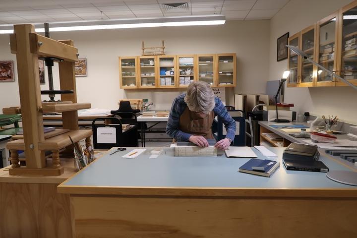 A woman working in a conservation lab.