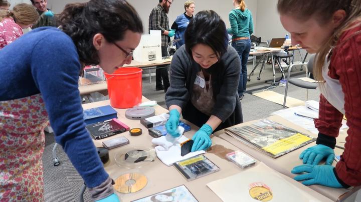 Participants working together with the wet materials.