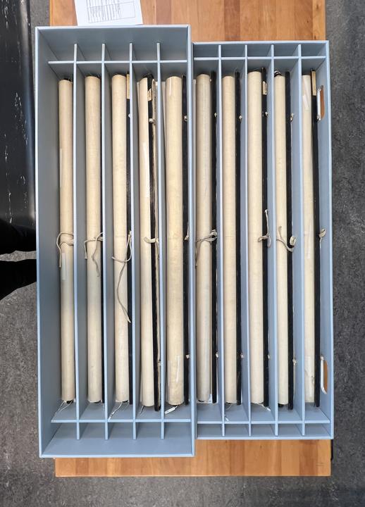 A box with 10 dividers to house rolled charts. 