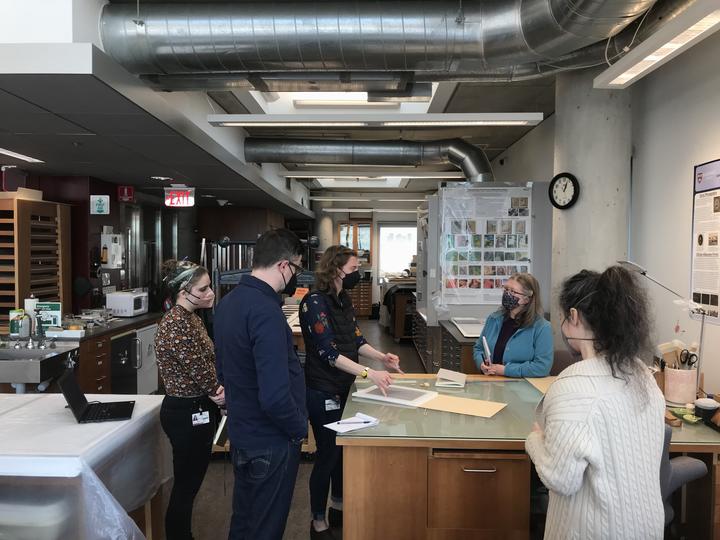 A group discussing different options for housing a large collection of tintypes.